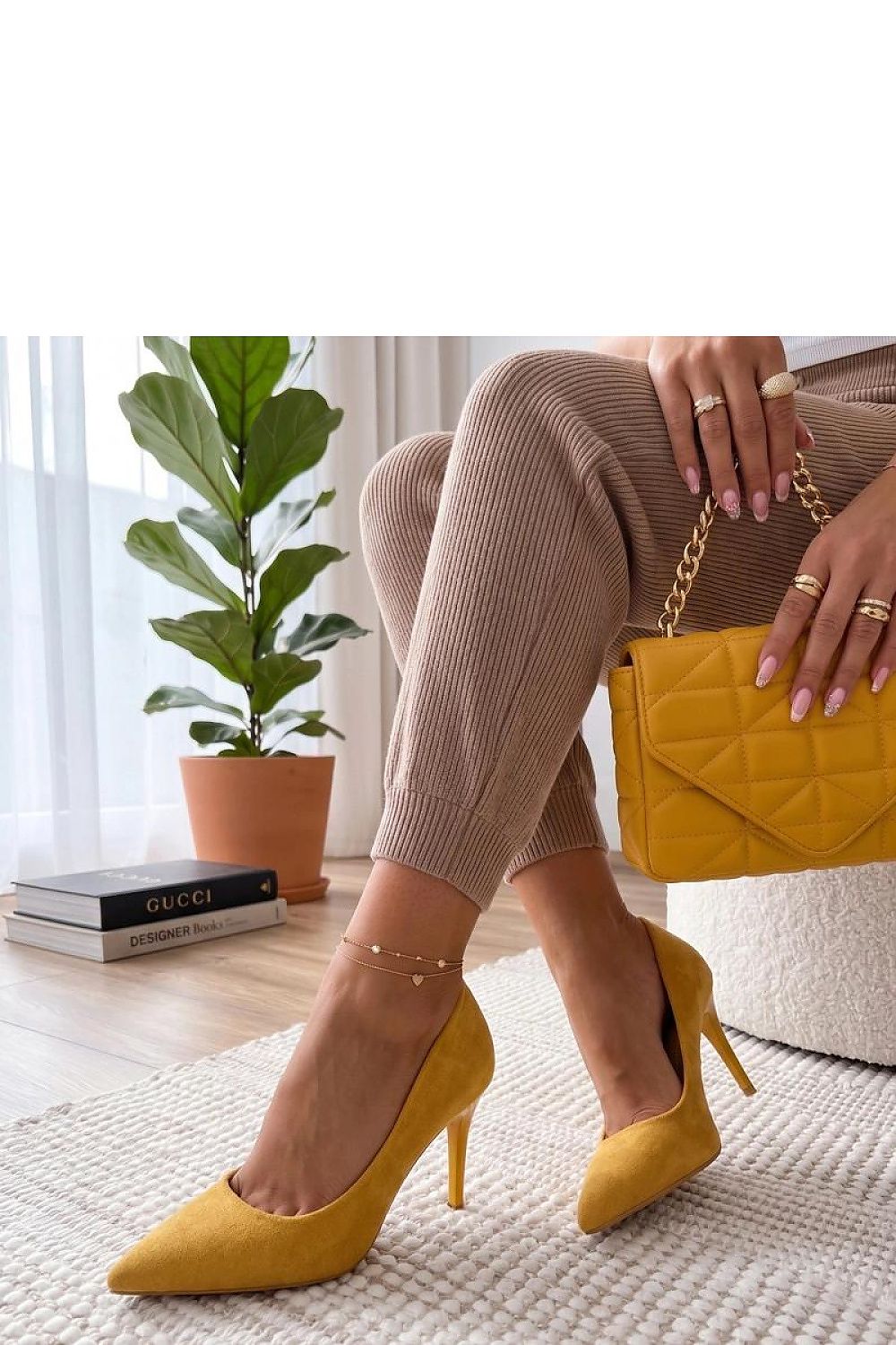 Women's yellow suede heels detail
