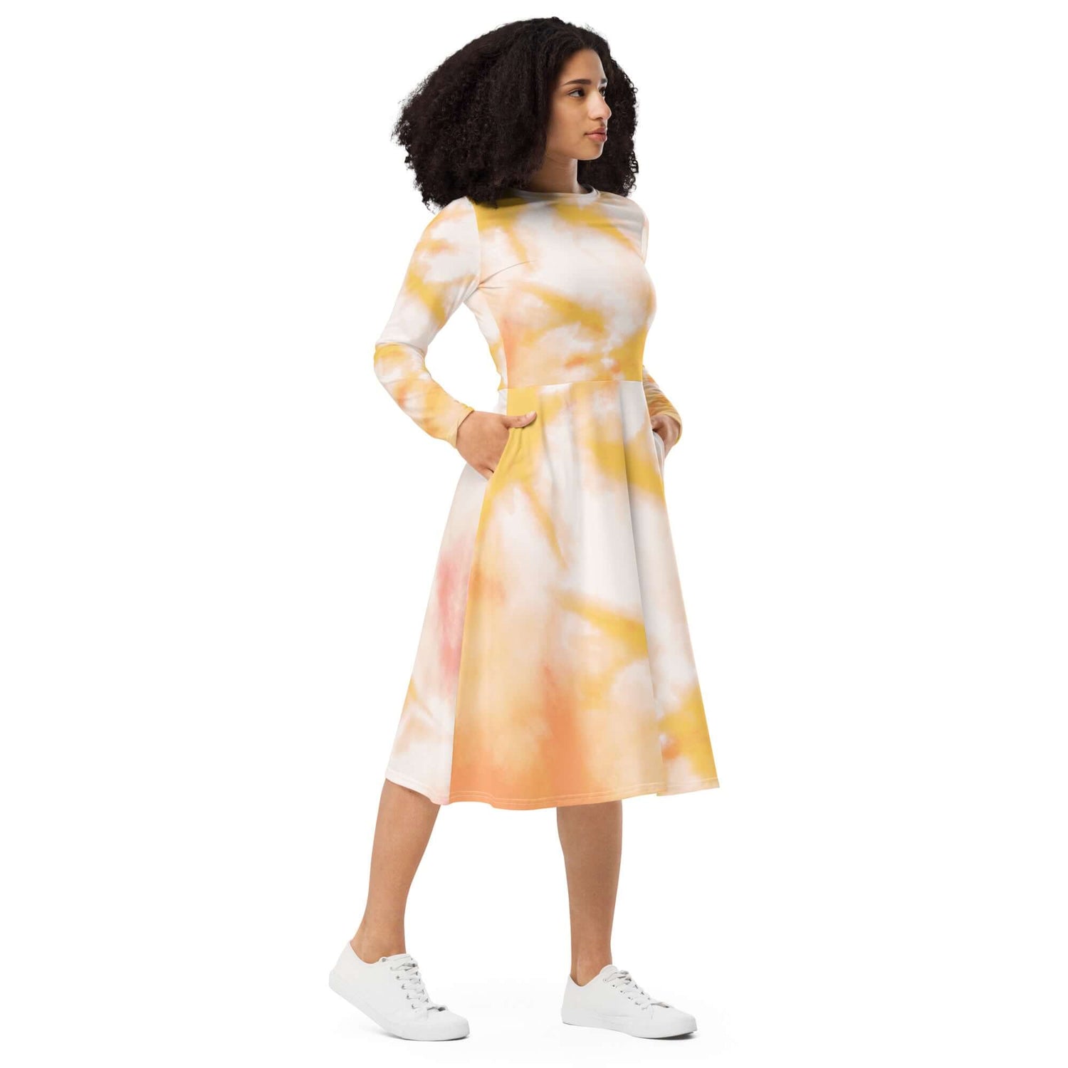 Charming tie-dye midi dress with long sleeves, featuring a colorful orange and yellow pattern. Ideal for stylish comfort.